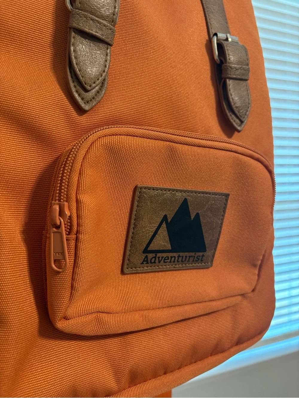 Orange Canvas Backpack with Brown Accents